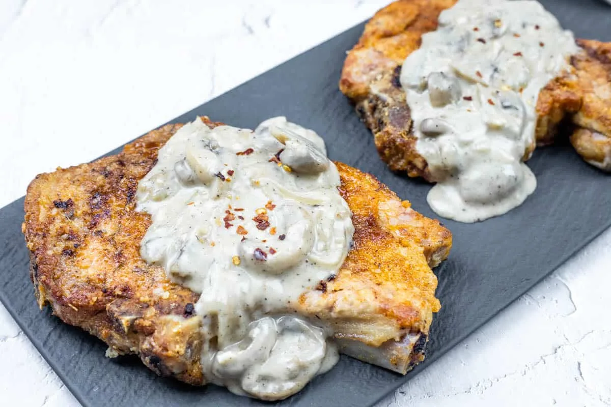 Smothered Pork Chops with Onions & Mushrooms